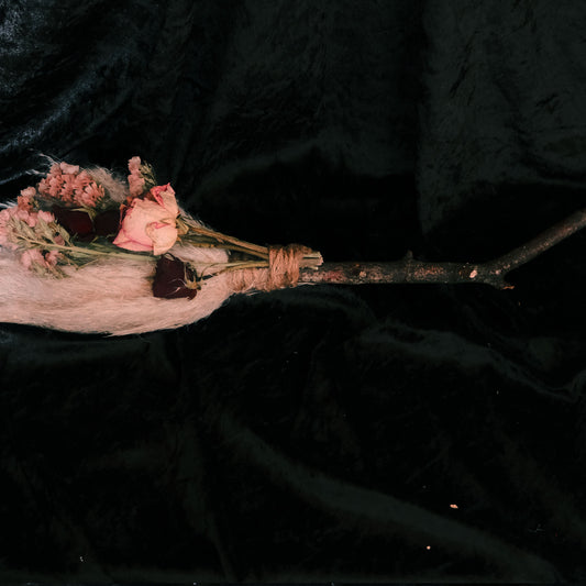 Broom stick crafted with home grown dried florals. Used to adorn the walls or as an altar tool.