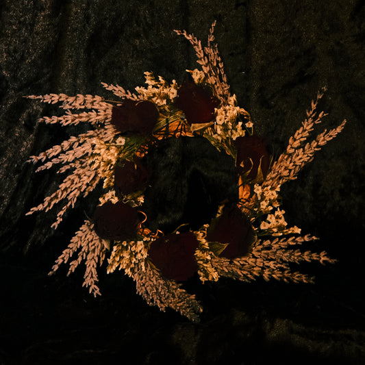 Bouquet of dark red roses and dried lavender herbs on a dark velvet background