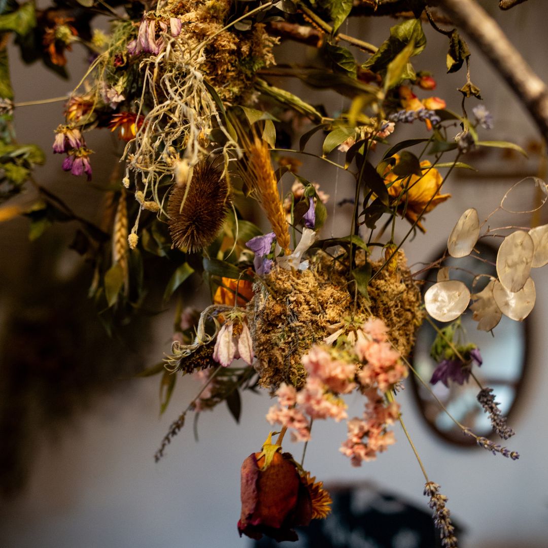 Close-up of a enchanting dried floral arrangement with various colours against a blurred background